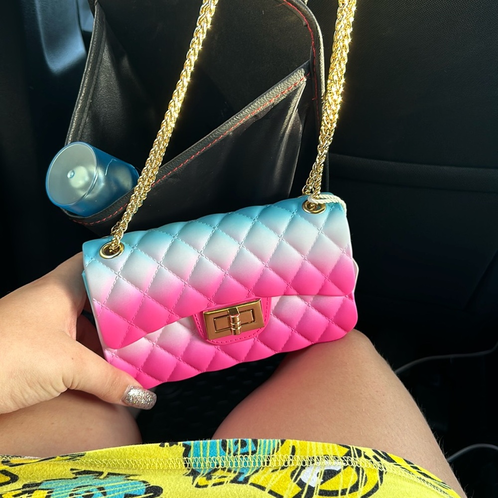 A pink purse, pink and blue purse very beautiful very authentic